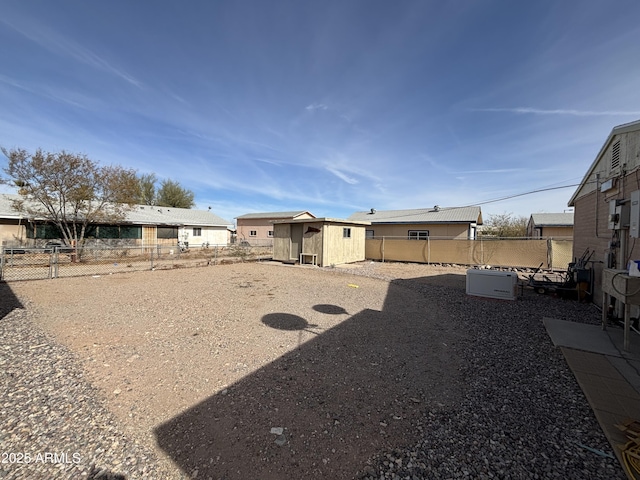 view of yard featuring a fenced backyard and an outdoor structure