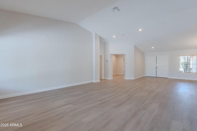 unfurnished living room featuring lofted ceiling, visible vents, baseboards, light wood-type flooring, and recessed lighting