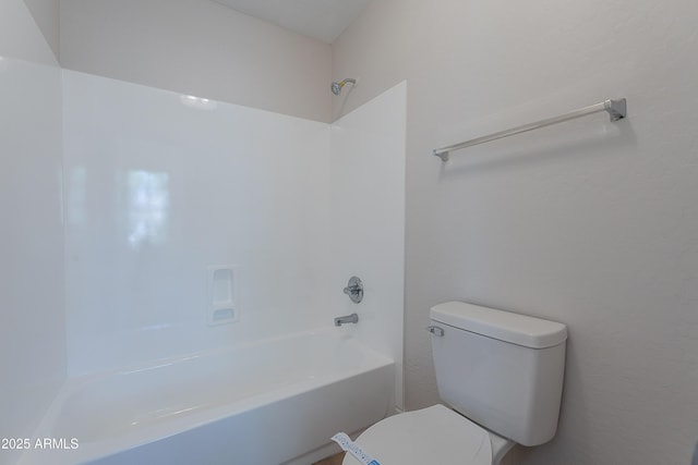 bathroom featuring toilet and shower / tub combination
