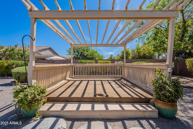 deck with fence and a pergola