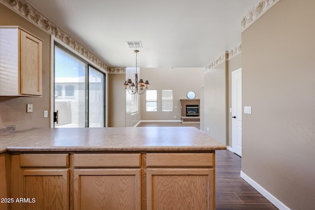 125 N 22nd Pl Unit 14, Mesa, AZ 85213 - kitchen with a peninsula, a chandelier, light brown cabinets, dark wood-type flooring, and open floor plan