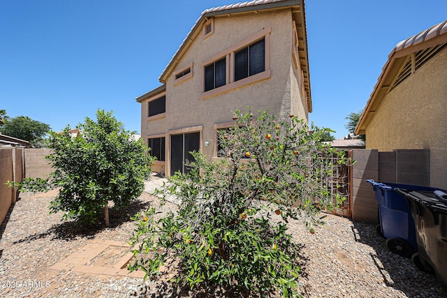 125 N 22nd Pl Unit 14, Mesa, AZ 85213 - back of house with stucco siding and a fenced backyard