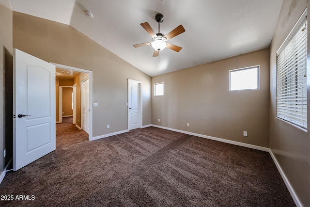 125 N 22nd Pl Unit 14, Mesa, AZ 85213 - unfurnished bedroom with carpet, lofted ceiling, multiple windows, and baseboards