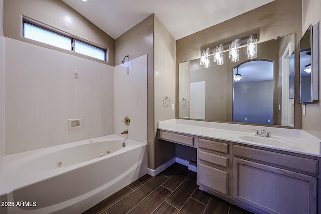 125 N 22nd Pl Unit 14, Mesa, AZ 85213 - full bath featuring ceiling fan, vanity, a combined bath / shower with jetted tub, wood finish floors, and baseboards