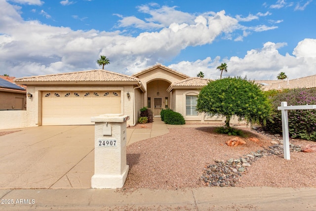 24907 S Lakestar Dr, Sun Lakes, AZ 85248 - view of front of property featuring driveway, an attached garage, stucco siding, and a tile roof