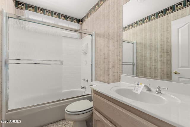 24907 S Lakestar Dr, Sun Lakes, AZ 85248 - full bathroom featuring wallpapered walls, vanity, toilet, and shower / bath combination with glass door