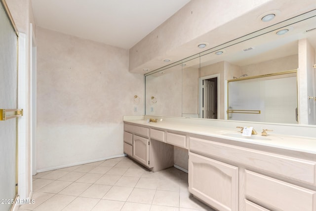 24907 S Lakestar Dr, Sun Lakes, AZ 85248 - bathroom featuring double vanity, a stall shower, tile patterned floors, and baseboards