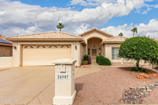 24907 S Lakestar Dr, Sun Lakes, AZ 85248 - view of front of house featuring driveway, an attached garage, stucco siding, and a tile roof