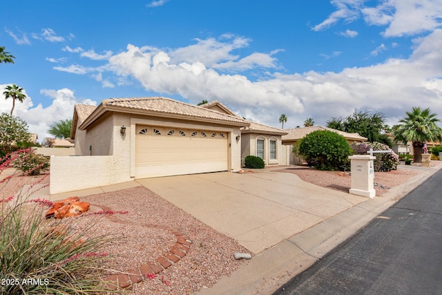 24907 S Lakestar Dr, Sun Lakes, AZ 85248 - view of front of home with stucco siding, a garage, driveway, and a tile roof