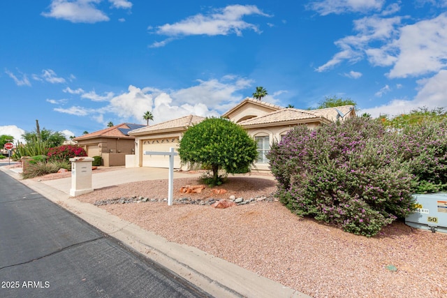 24907 S Lakestar Dr, Sun Lakes, AZ 85248 - view of front of home featuring concrete driveway, stucco siding, an attached garage, and a tiled roof
