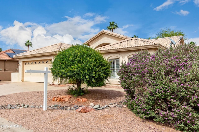 24907 S Lakestar Dr, Sun Lakes, AZ 85248 - view of front of home featuring stucco siding, driveway, a garage, and a tile roof