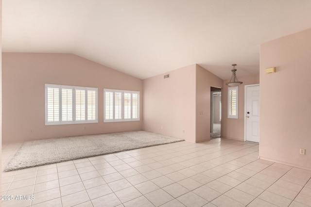 24907 S Lakestar Dr, Sun Lakes, AZ 85248 - empty room with plenty of natural light, vaulted ceiling, and light tile patterned floors