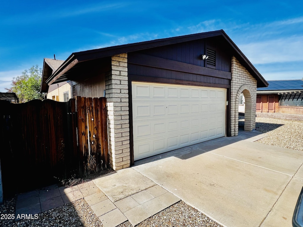 view of side of property with a garage