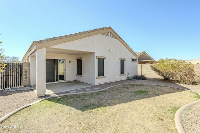 rear view of house featuring a patio