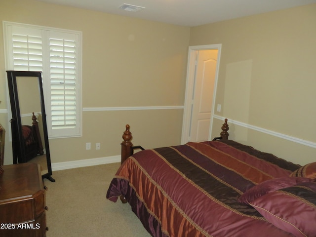 bedroom featuring light carpet