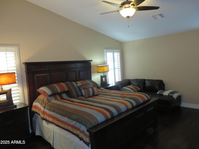 bedroom with vaulted ceiling, dark hardwood / wood-style floors, and ceiling fan