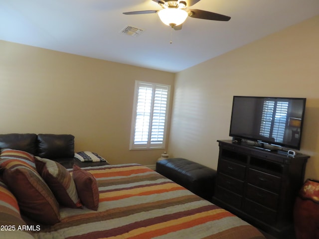 bedroom with lofted ceiling and ceiling fan