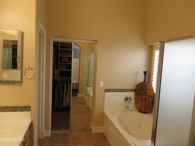 bathroom with vanity, tile patterned flooring, and separate shower and tub