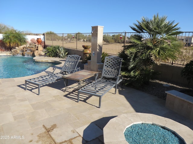 view of pool featuring a patio area and pool water feature