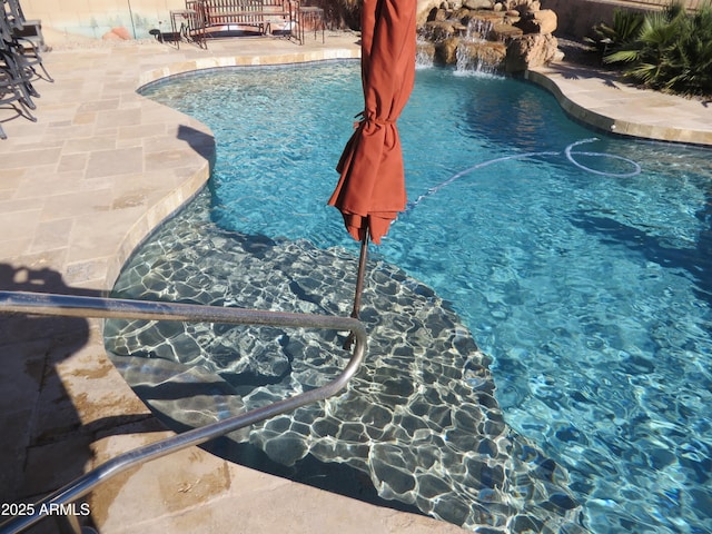 view of pool featuring pool water feature