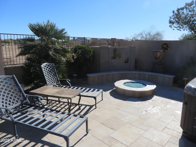 view of patio / terrace with an outdoor fire pit