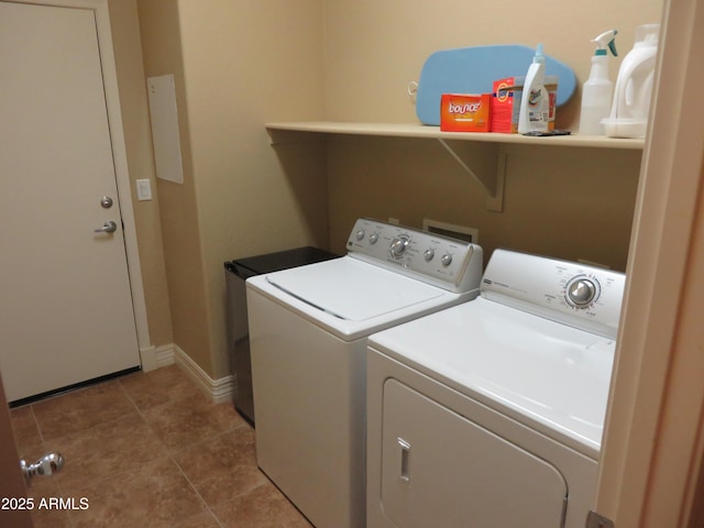 laundry room with tile patterned floors and washer and dryer