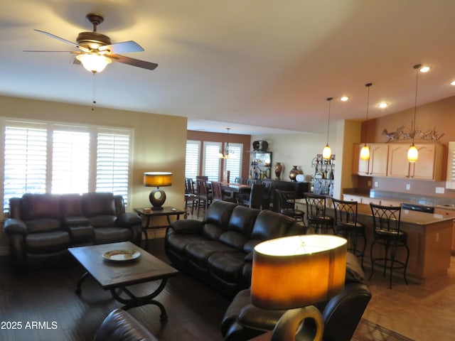 living room featuring dark hardwood / wood-style floors and ceiling fan