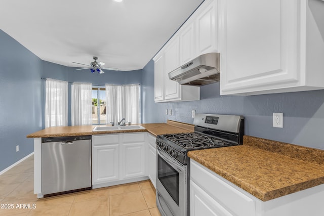 11630 W Jefferson St, Avondale, AZ 85323 - kitchen with stainless steel appliances, range hood, a peninsula, and light tile patterned floors