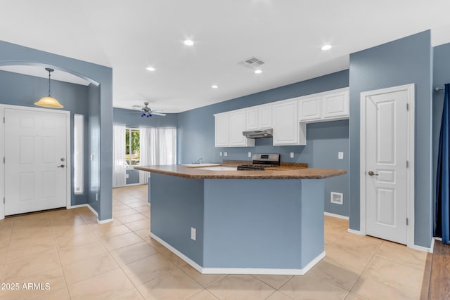 11630 W Jefferson St, Avondale, AZ 85323 - kitchen with stainless steel range, under cabinet range hood, white cabinetry, a ceiling fan, and recessed lighting