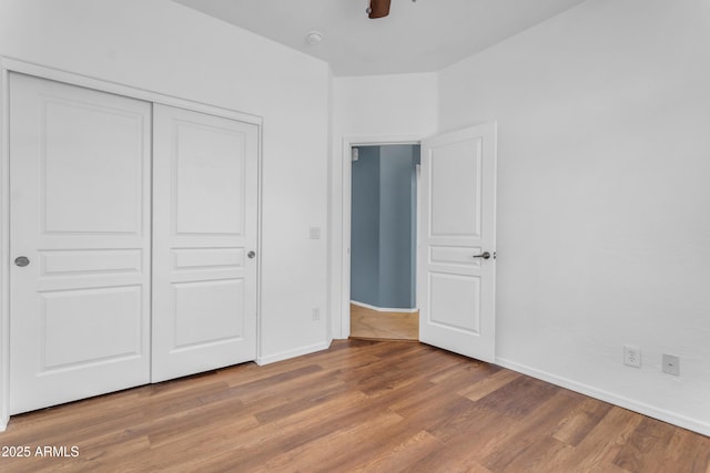 11630 W Jefferson St, Avondale, AZ 85323 - unfurnished bedroom with light wood finished floors, a closet, and a ceiling fan