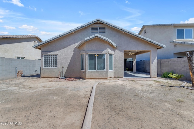 11630 W Jefferson St, Avondale, AZ 85323 - back of house featuring a fenced backyard, a patio area, ceiling fan, and stucco siding
