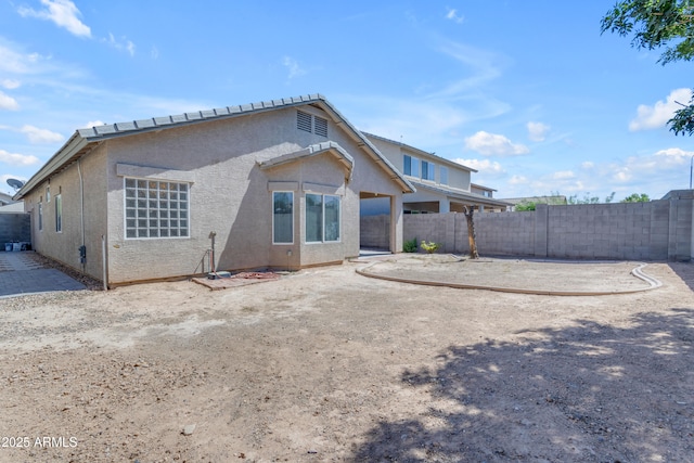 11630 W Jefferson St, Avondale, AZ 85323 - rear view of house with a fenced backyard and stucco siding
