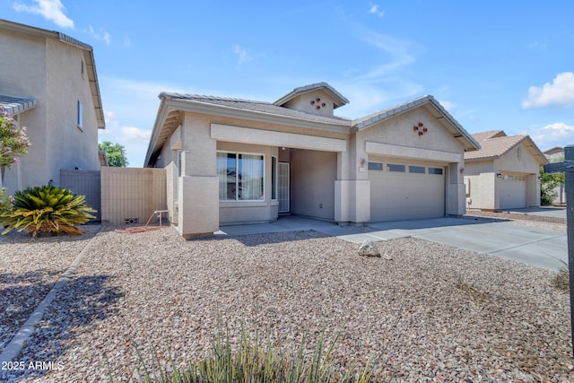 11630 W Jefferson St, Avondale, AZ 85323 - view of front of house with a garage, a tile roof, driveway, and stucco siding