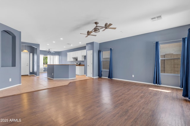 11630 W Jefferson St, Avondale, AZ 85323 - unfurnished living room featuring ceiling fan, light wood finished floors, and recessed lighting