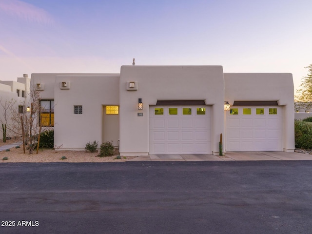 adobe home featuring stucco siding