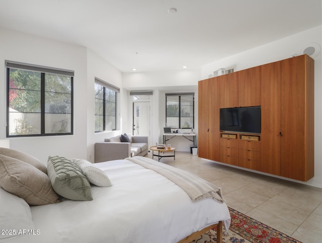 bedroom with light tile patterned flooring and recessed lighting