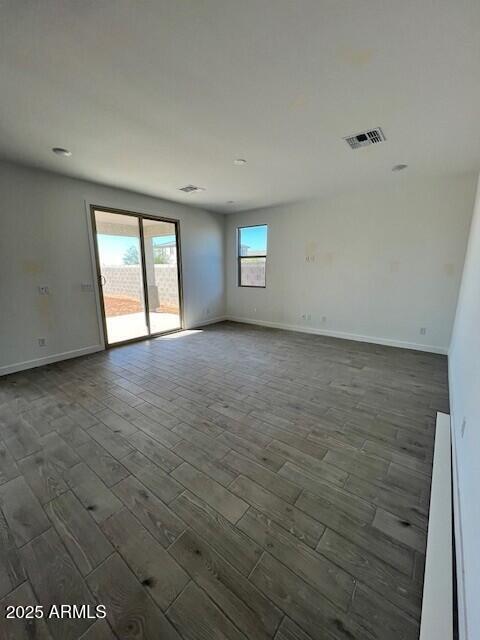 unfurnished room featuring dark hardwood / wood-style floors