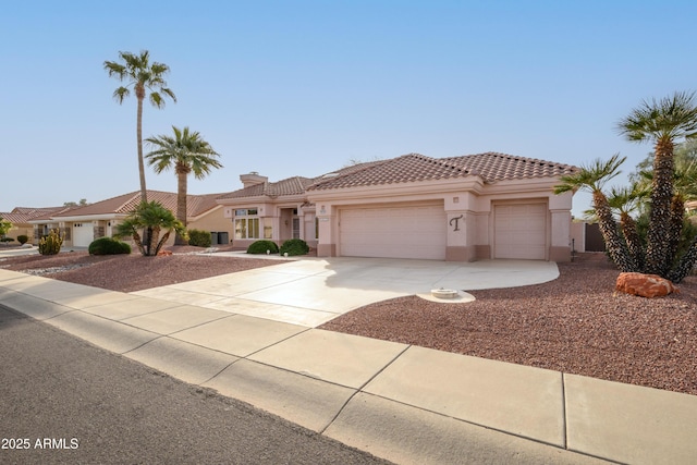 mediterranean / spanish-style home featuring a garage