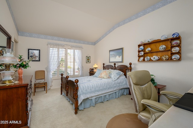 bedroom with vaulted ceiling and light colored carpet