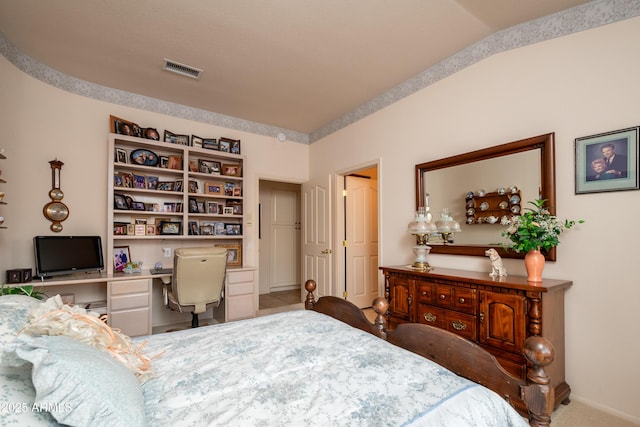 bedroom featuring built in desk