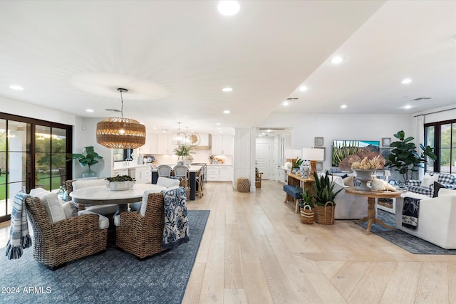 dining space with light hardwood / wood-style floors