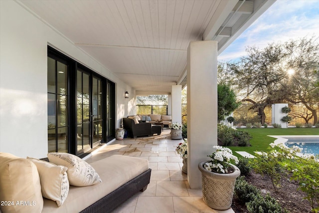 view of patio / terrace featuring a fenced in pool and an outdoor hangout area