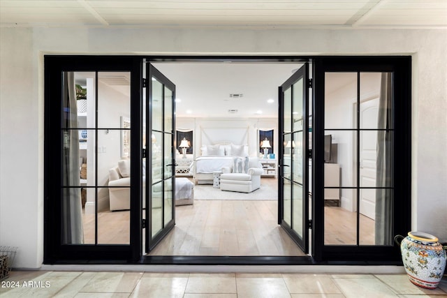 doorway to outside with hardwood / wood-style flooring, wood ceiling, and french doors