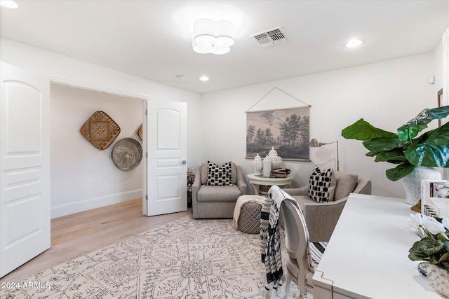 office with light hardwood / wood-style floors