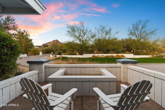 balcony at dusk with a fire pit