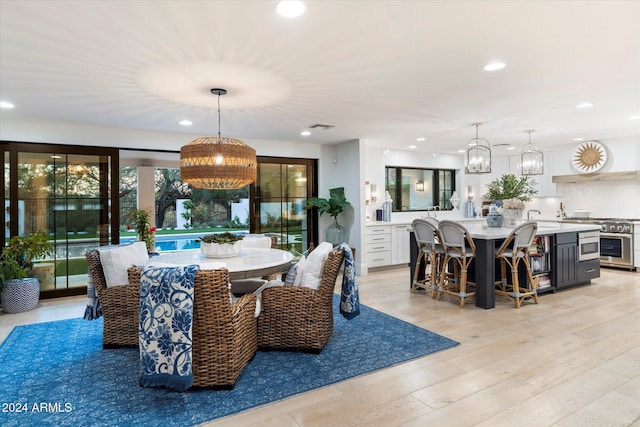 dining space featuring light hardwood / wood-style flooring