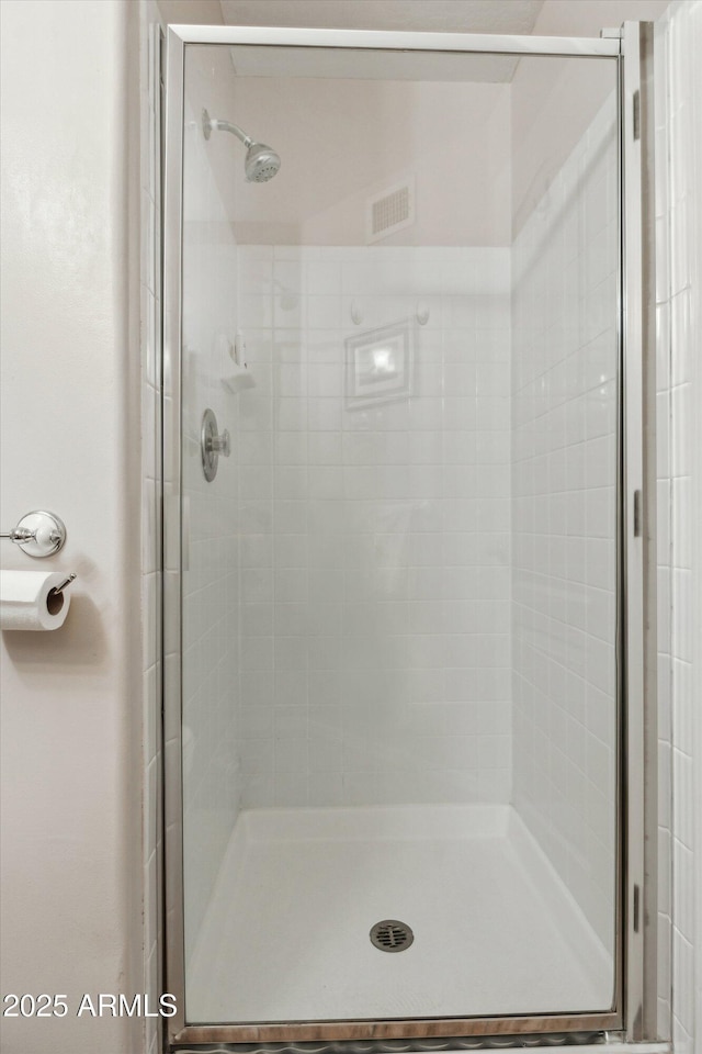 bathroom featuring walk in shower