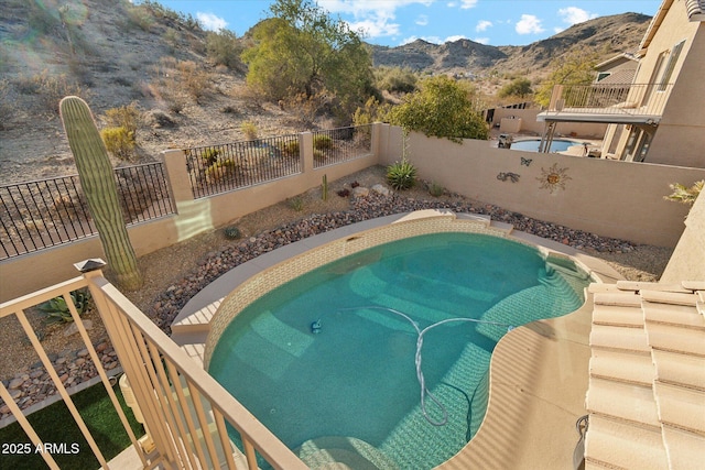 view of pool with a mountain view