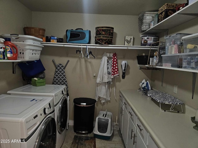 clothes washing area with tile patterned floors, cabinets, and independent washer and dryer