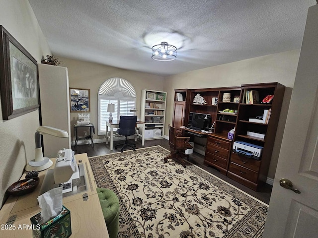 office with a textured ceiling and hardwood / wood-style flooring